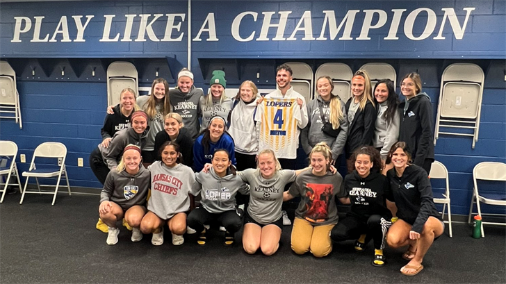 Coach Rob Breton poses with the UNK soccer team. Image courtesy: UNK Athletics