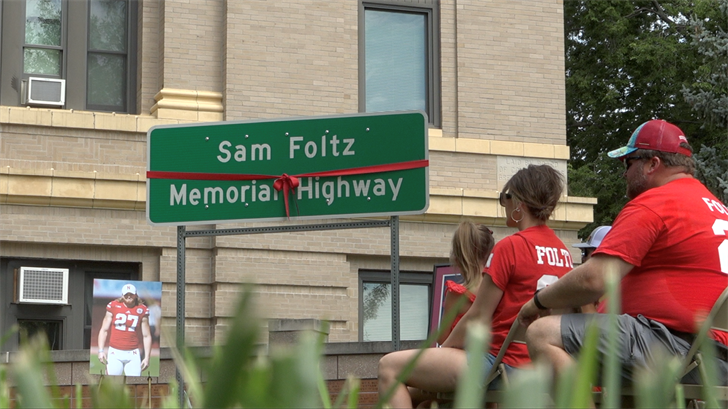 Family, friends, community dedicate Sam Foltz Memorial Highway - Vimarsana News