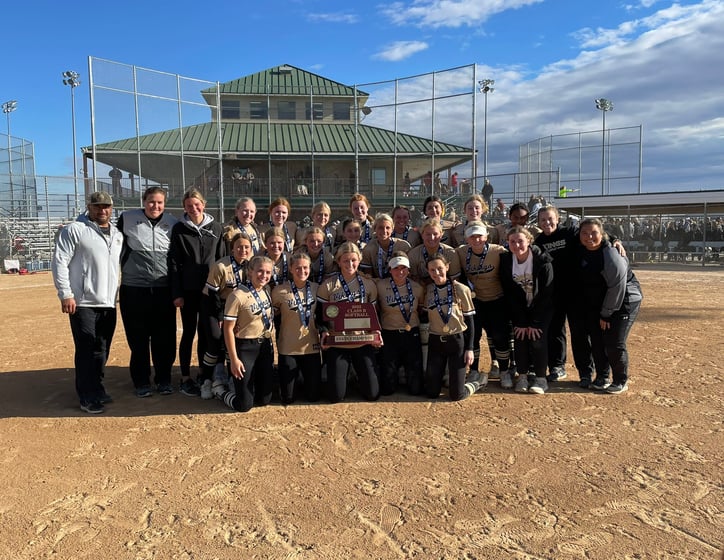 The Northwest High School team poses with the Class B state championship trophy at Smith Softball Complex in Hastings.