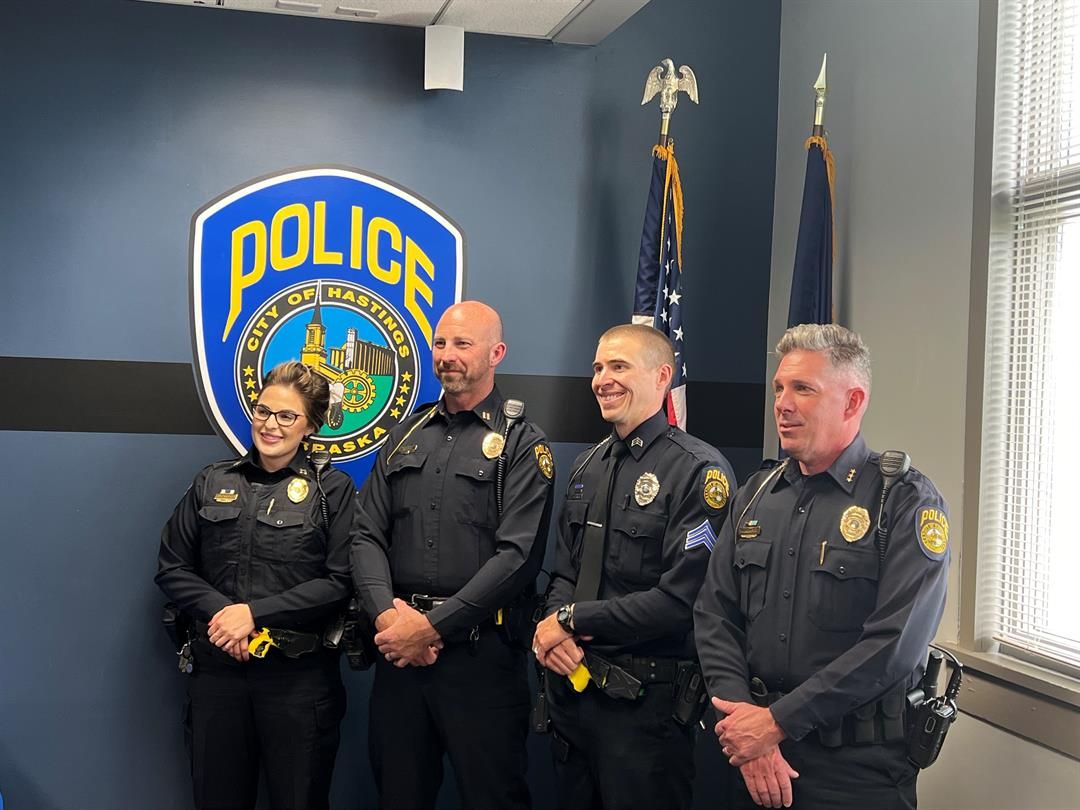 (From left) Hastings Police Department Captains Raelee Van Winkle and Jason Haase, Sergeant Nathan Hanson and Chief Adam Story pose for photographs following a promotion ceremony for Haase and Hanson on Thursday afternoon, June 1. Credit: City of Hasting