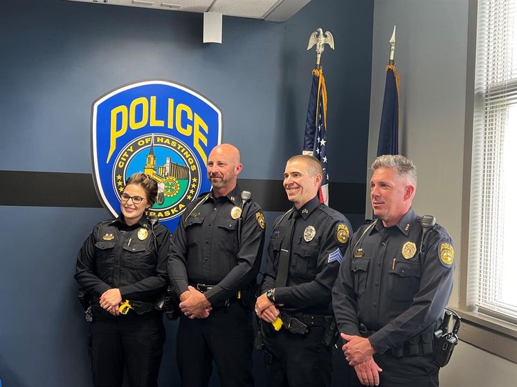 (From left) Hastings Police Department Captains Raelee Van Winkle and Jason Haase, Sergeant Nathan Hanson and Chief Adam Story pose for photographs following a promotion ceremony for Haase and Hanson on Thursday afternoon, June 1. Credit: City of Hasting