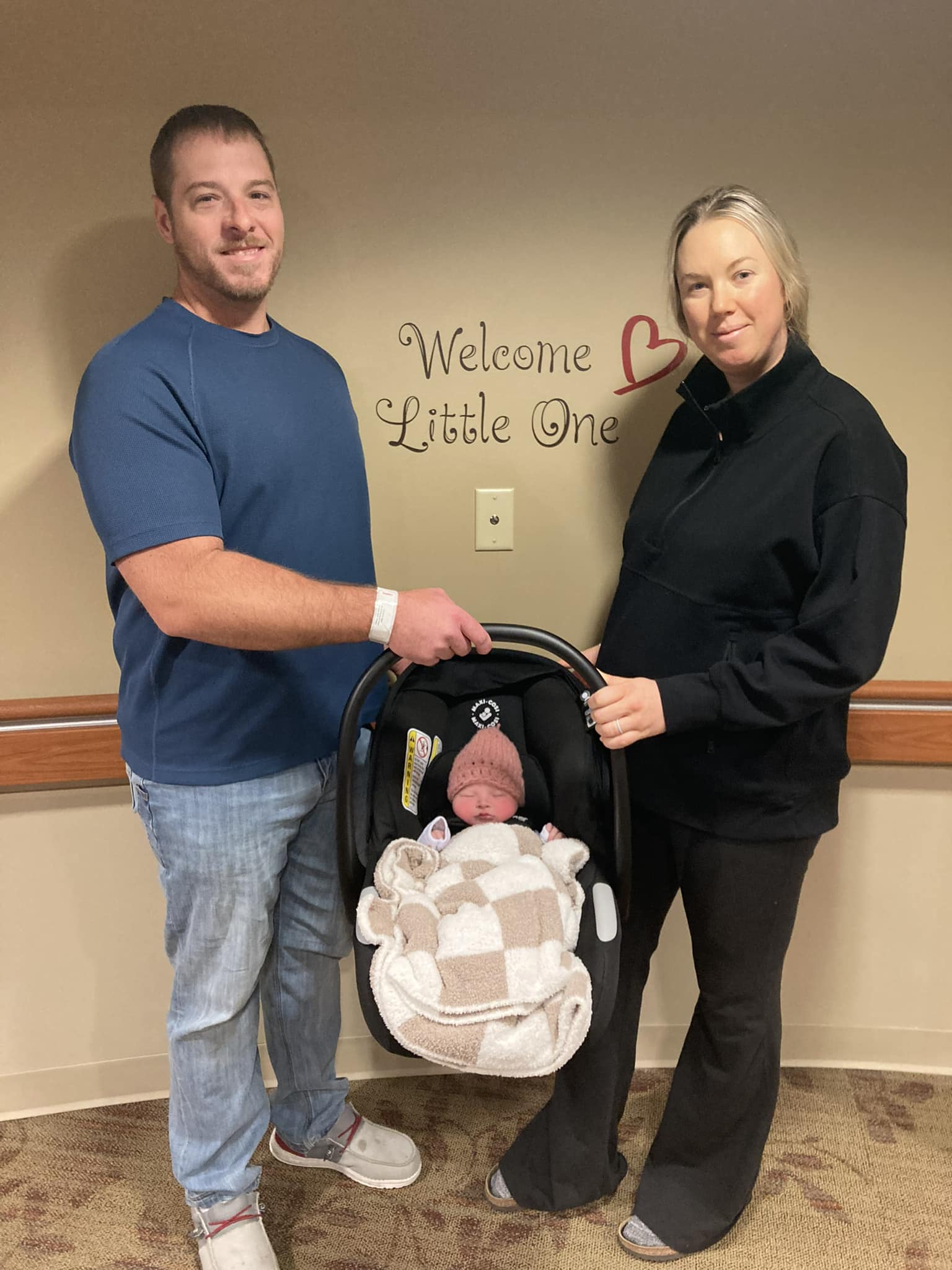 Baby girl Hunter, with parents Kevin (left), Liz (right)