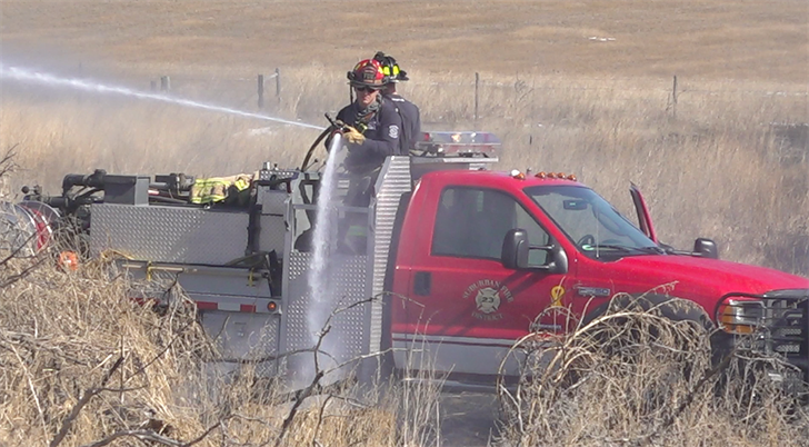 Firefighters work to extinguish blaze North of Kearney Monday Afternoon