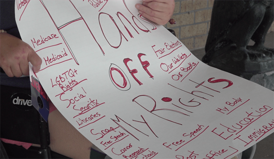 Protestors gather at Senator Pete Ricketts’ Kearney office